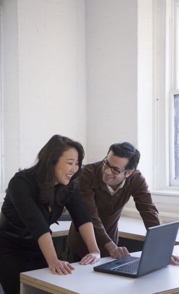 Multi-ethnic businesspeople laughing