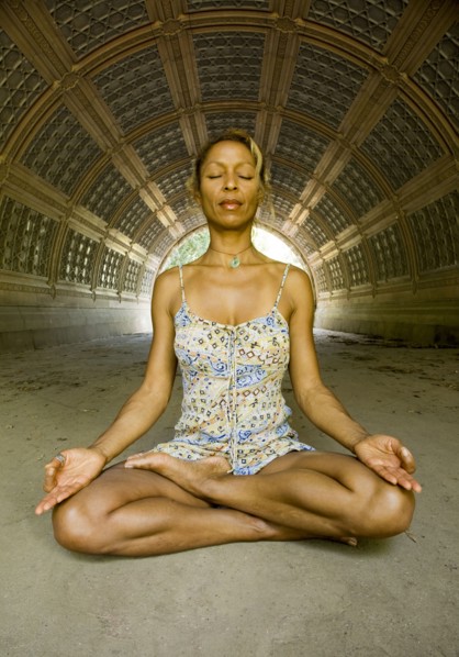 Mixed race woman practicing yoga