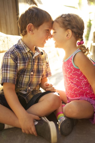 Brother and sister looking at each other