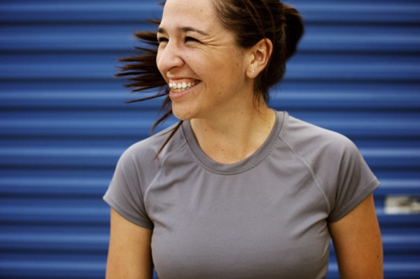 Athletic mixed race woman laughing outdoors