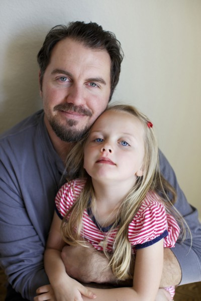 Father and daughter smiling