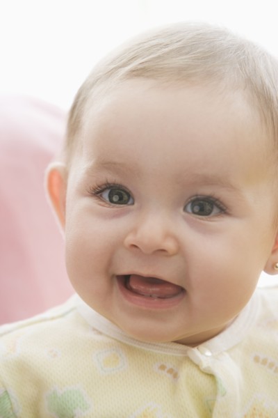 Smiling Hispanic baby girl