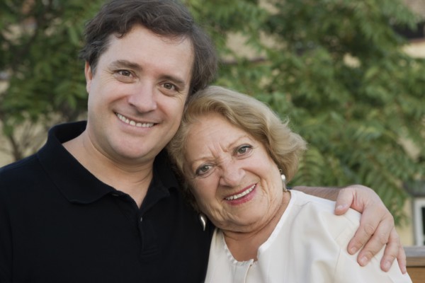 Smiling mother and adult son