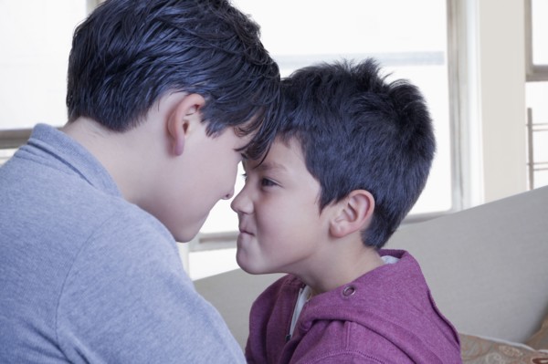 Hispanic brothers face to face with attitude