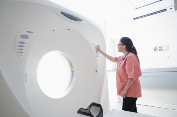 Hispanic nurse checking scanner