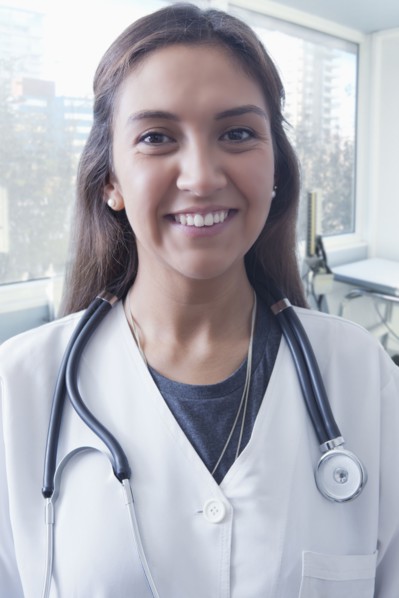 Portrait of smiling Hispanic doctor