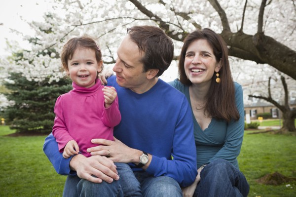 Caucasian family sitting together outdoors