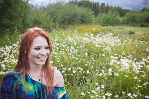 Caucasian woman standing in field