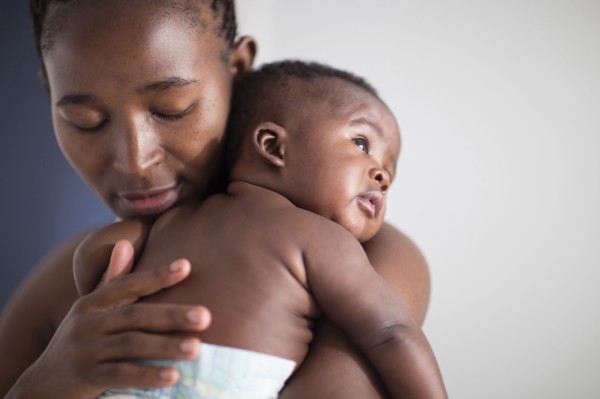 Close up of Black mother holding baby