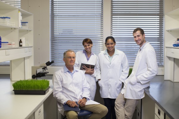Scientists smiling in laboratory