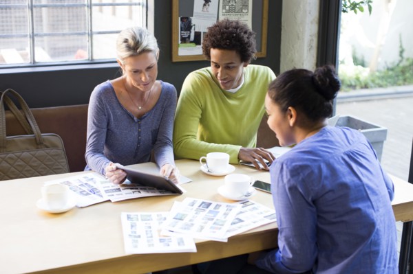 Business people using digital tablet in office meeting