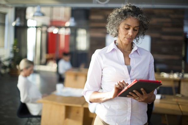 Businesswoman using digital tablet in office