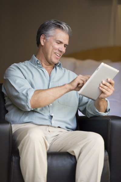 Caucasian man using tablet computer
