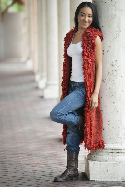 Black woman leaning on pillar