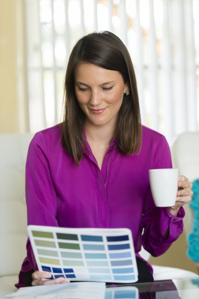 Caucasian businesswoman examining color swatches