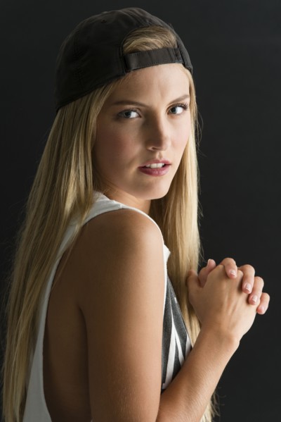 Serious Caucasian woman looking over her shoulder