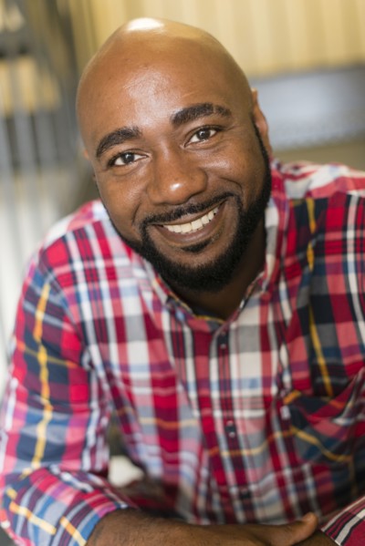 Black man sitting on stairs