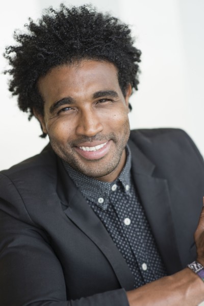 Close up of smiling Hispanic businessman