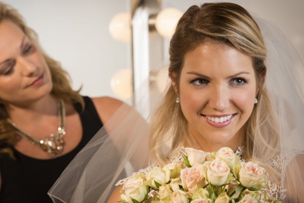 Close up of bride and maid of honor smiling