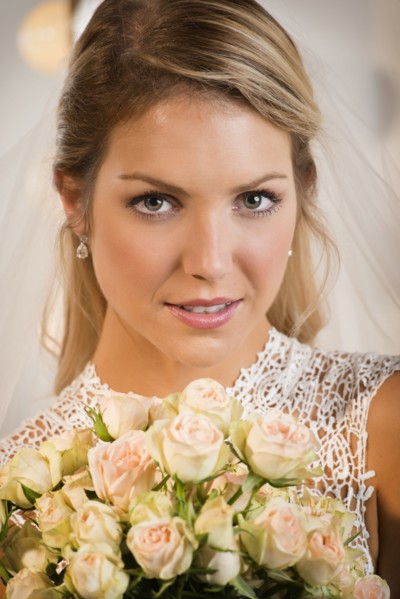 Close up of bride holding bouquet of flowers