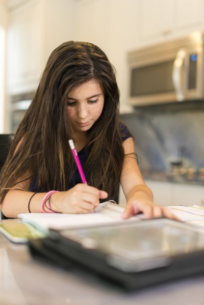 Mixed race girl doing homework