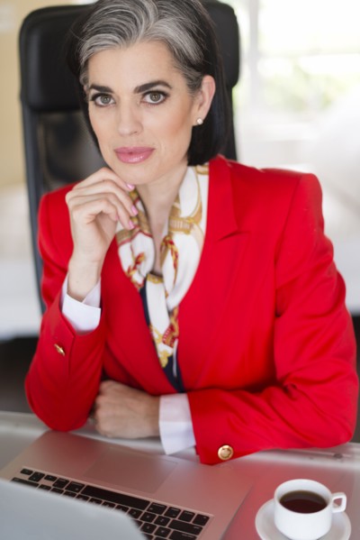 Caucasian businesswoman using laptop in office