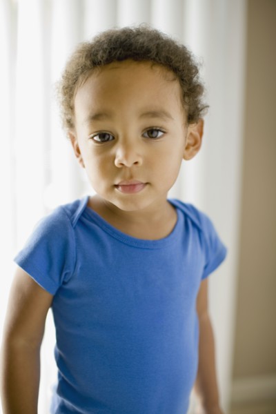 Serious mixed race young boy