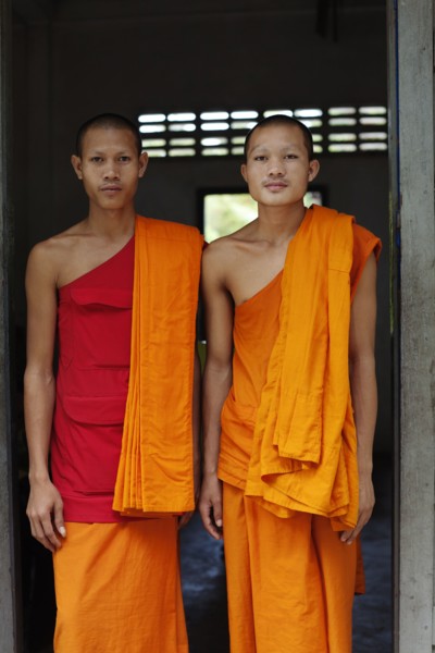 Cambodian monks standing in doorway