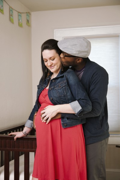 Man hugging pregnant wife