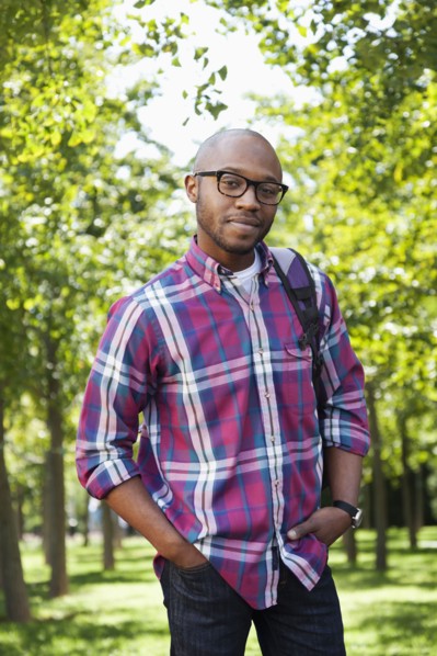 Black man smiling in park