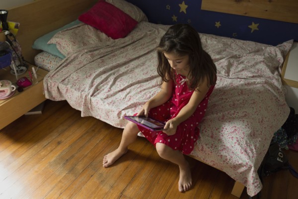 Mixed race girl using digital tablet
