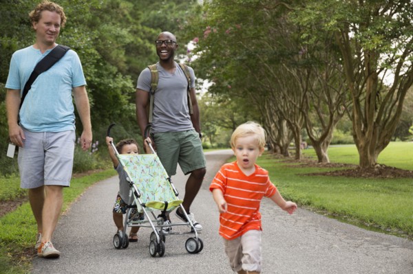 Fathers and sons walking together in park
