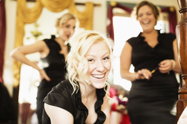 Caucasian bridesmaids smiling together