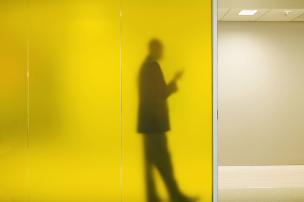 Silhouette of Caucasian businessman in office