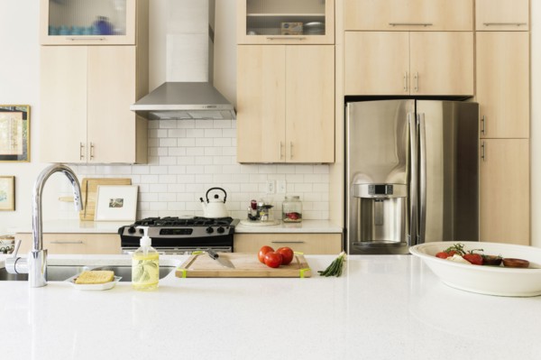 Food and cooking implements on kitchen counter