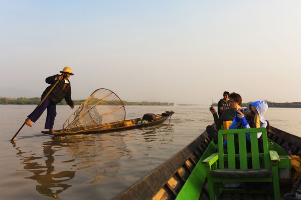Tourists riding in canoe on rural lake