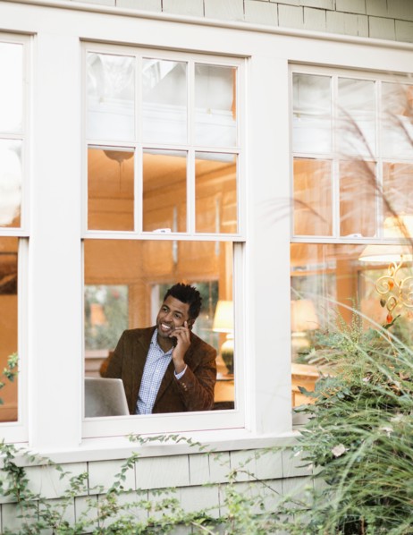 African American businessman talking on cell phone in office