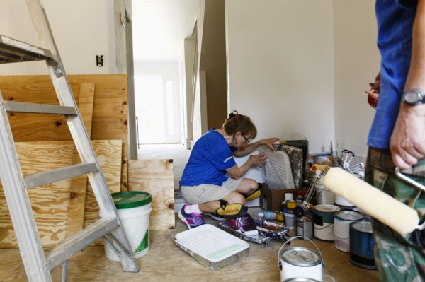 Women preparing to paint walls