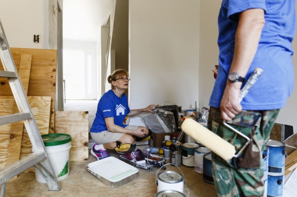 Women preparing to paint walls