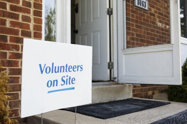 Volunteers sign on front stoop