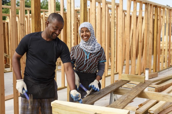 Black volunteers building house