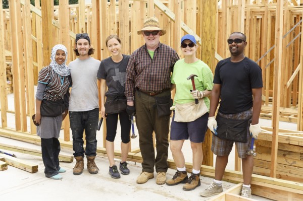 Volunteers posing at construction site