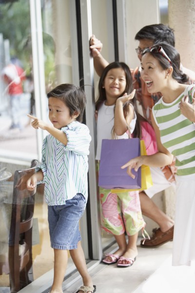 Asian family window shopping