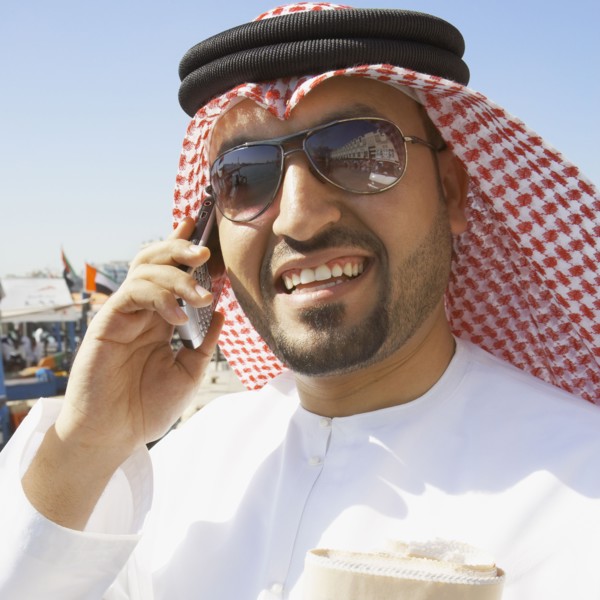 Close up of Arab man talking on cell phone