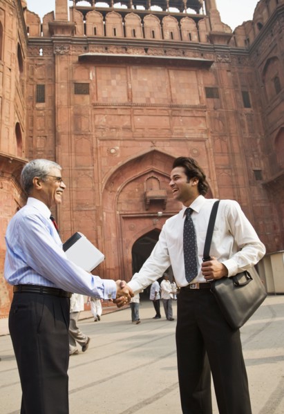 Indian businessman shaking hands at the Red Fort