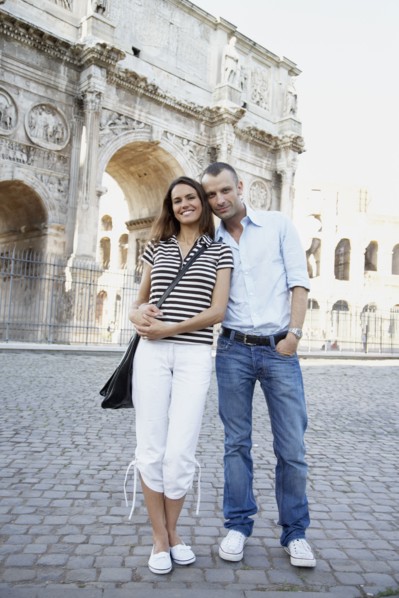 Tourist couple hugging near ruins