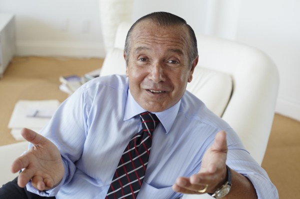 Hispanic businessman shrugging