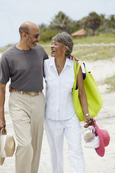 African couple walking on beach