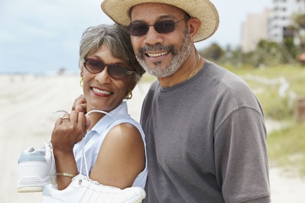 African couple enjoying beach