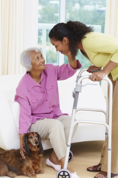 African American woman helping senior mother
